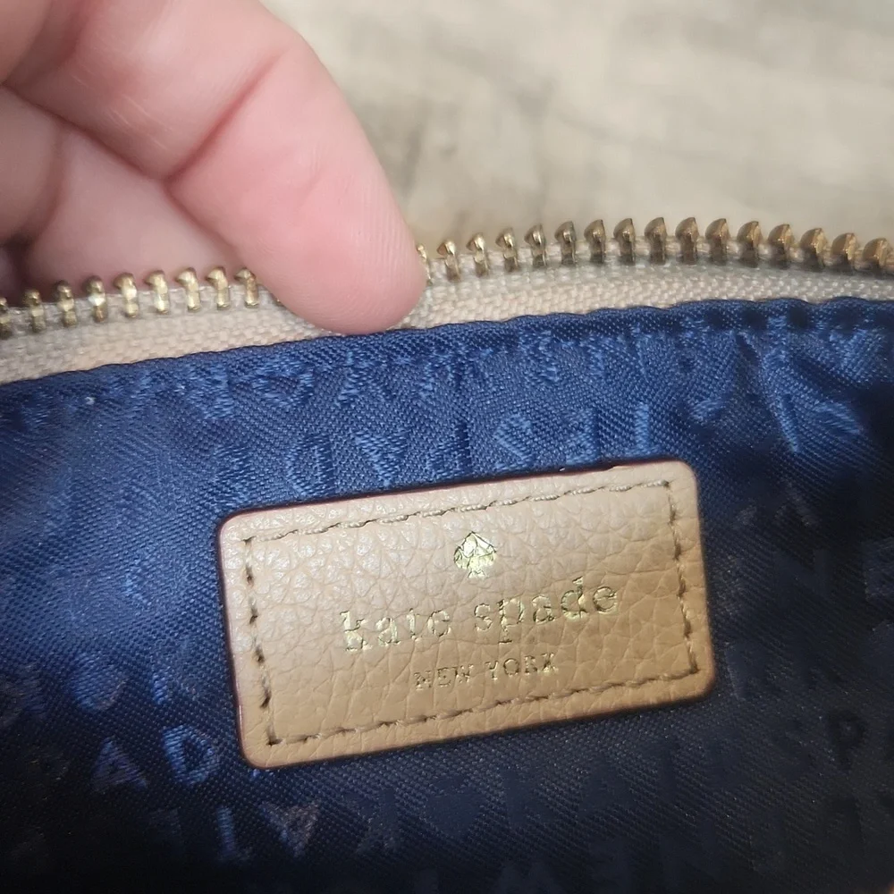 Kate Spade Leather Cream Wristlet with Navy Blue Interior‎
